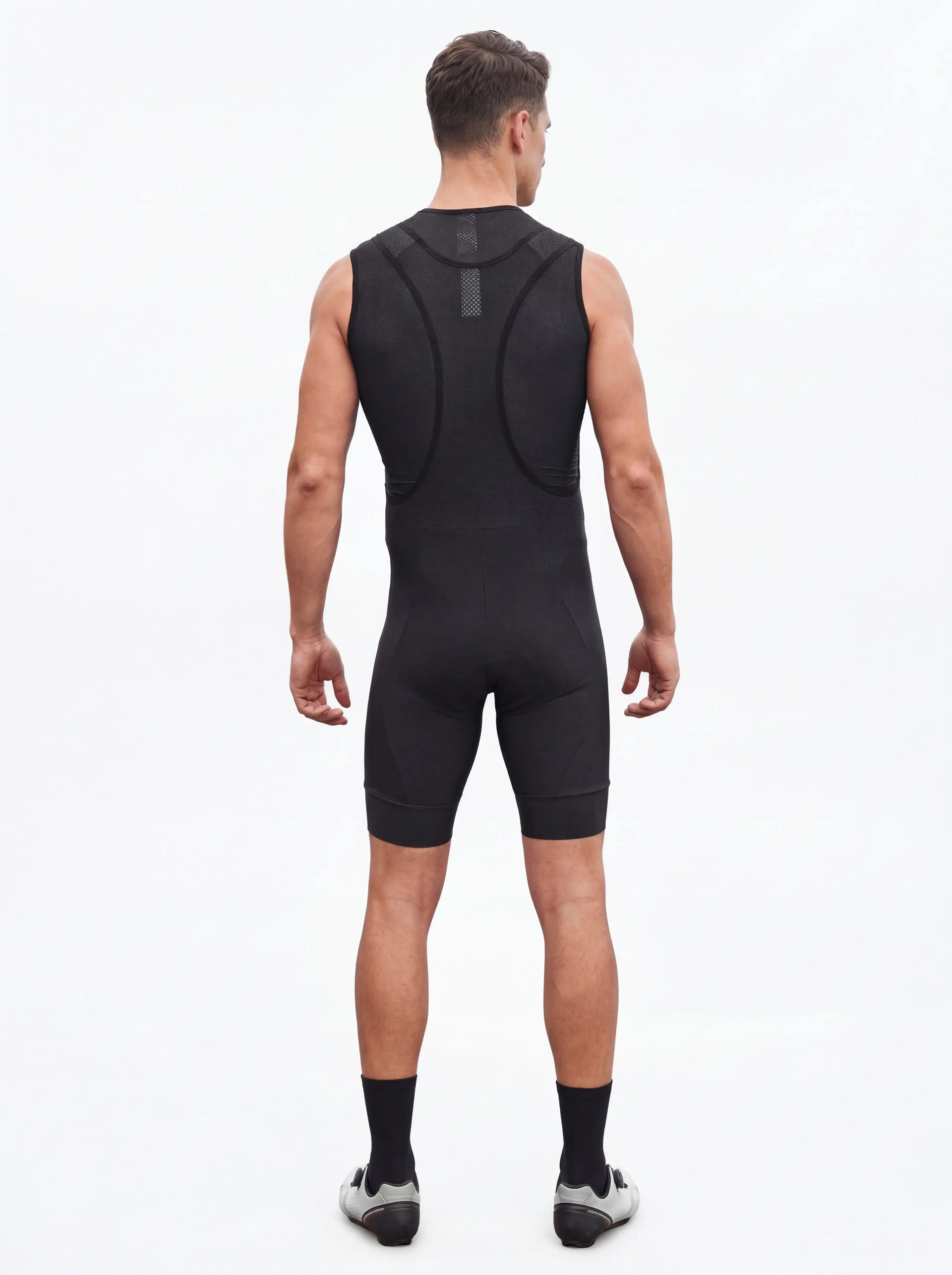 QUALICOS Men's Cycling Bib Shorts black back view on model with breathable mesh bib straps