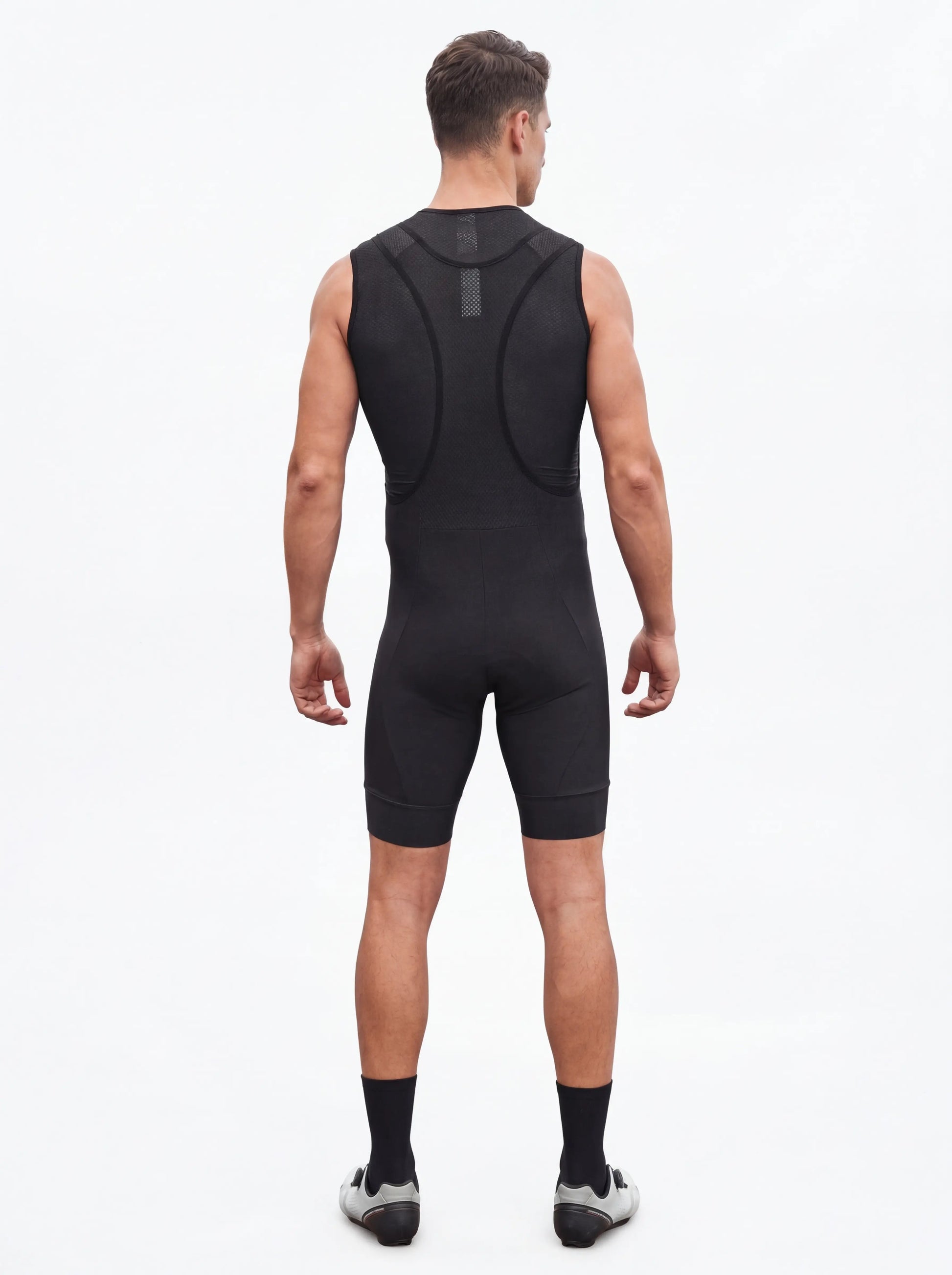 QUALICOS Men's Cycling Bib Shorts black back view on model with breathable mesh bib straps