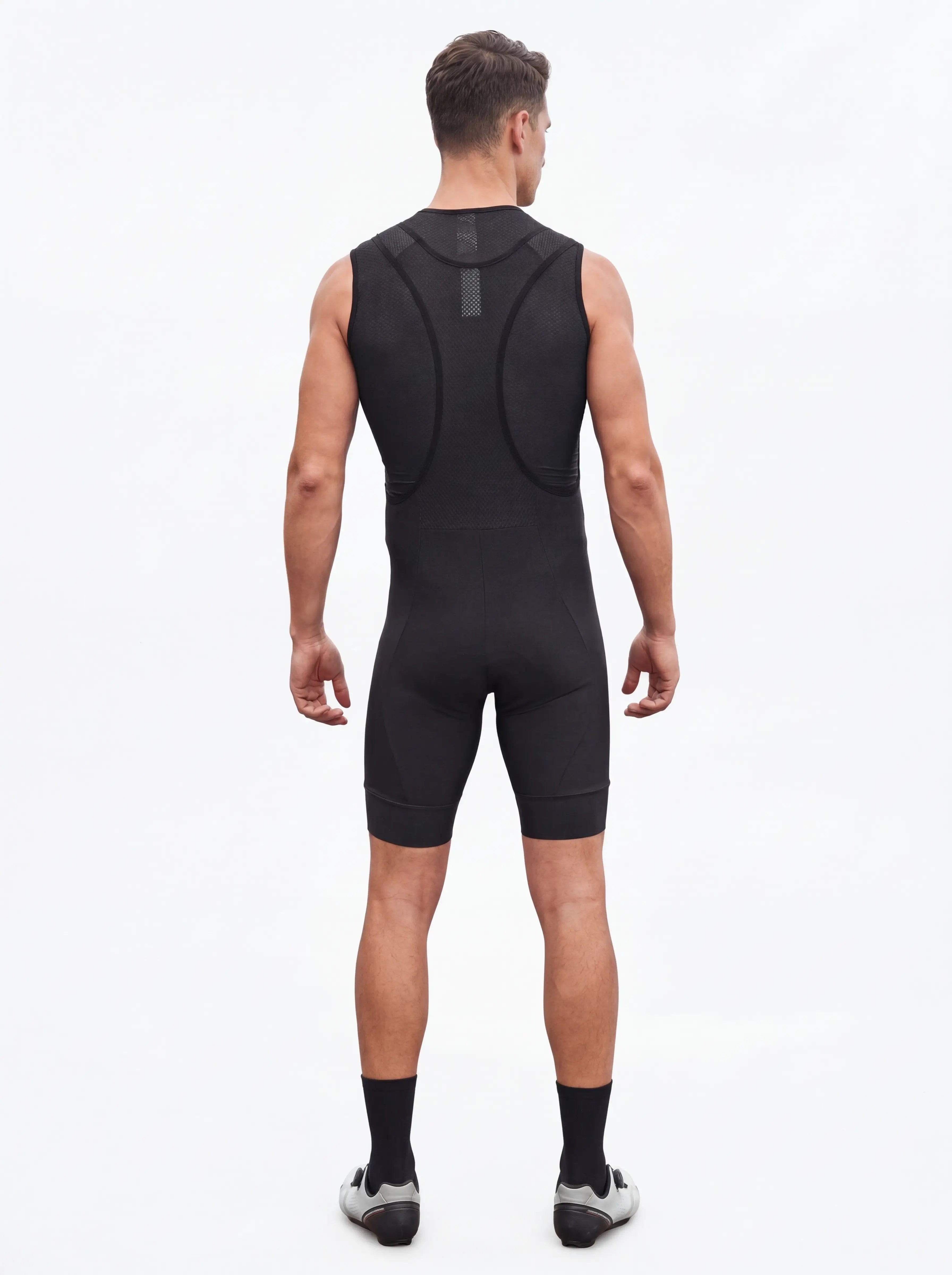 QUALICOS Men's Cycling Bib Shorts black back view on model with breathable mesh bib straps