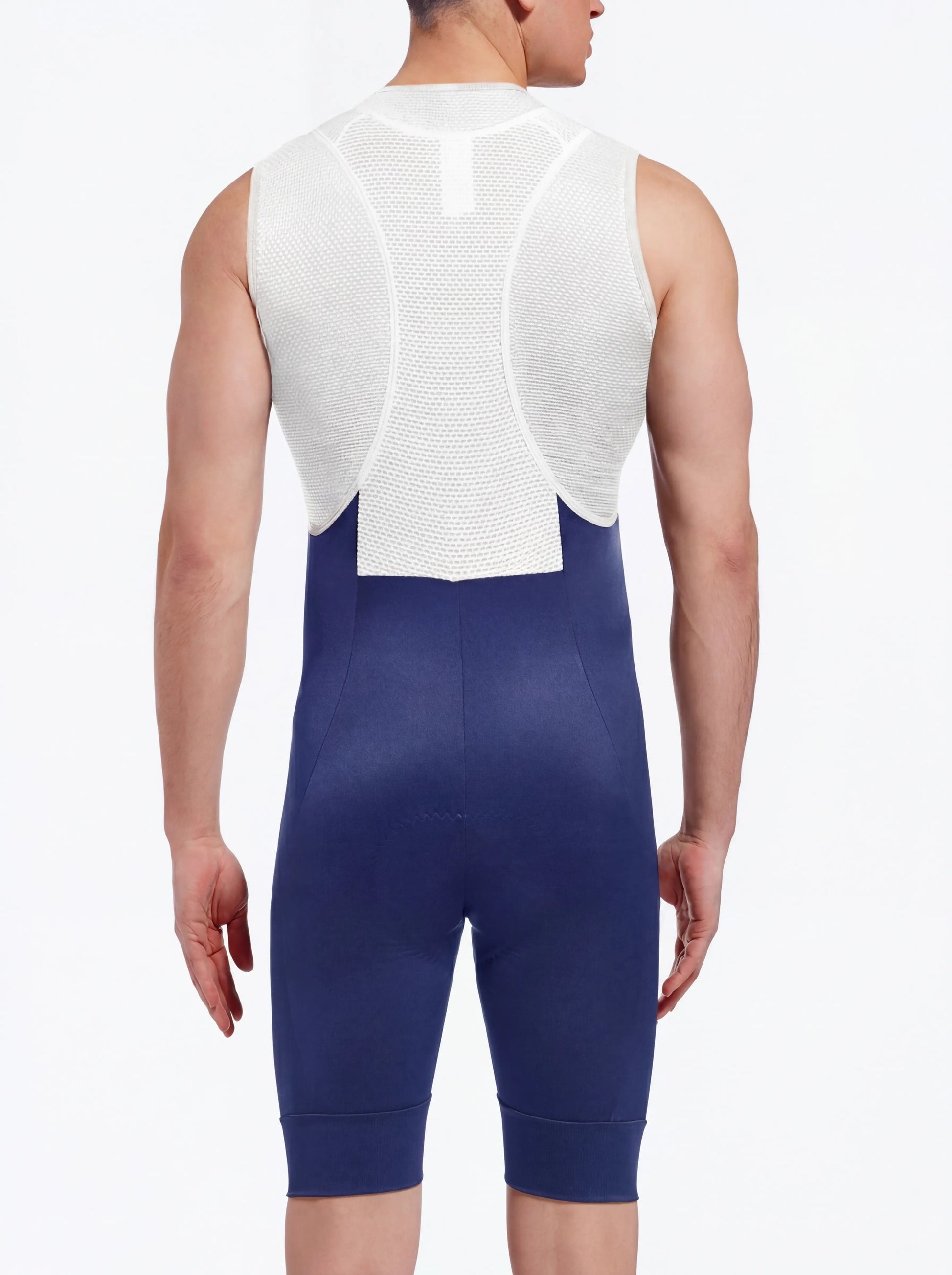 QUALICOS Men's Cycling Bib Shorts blue back view on model with white breathable mesh bib straps and padded seat