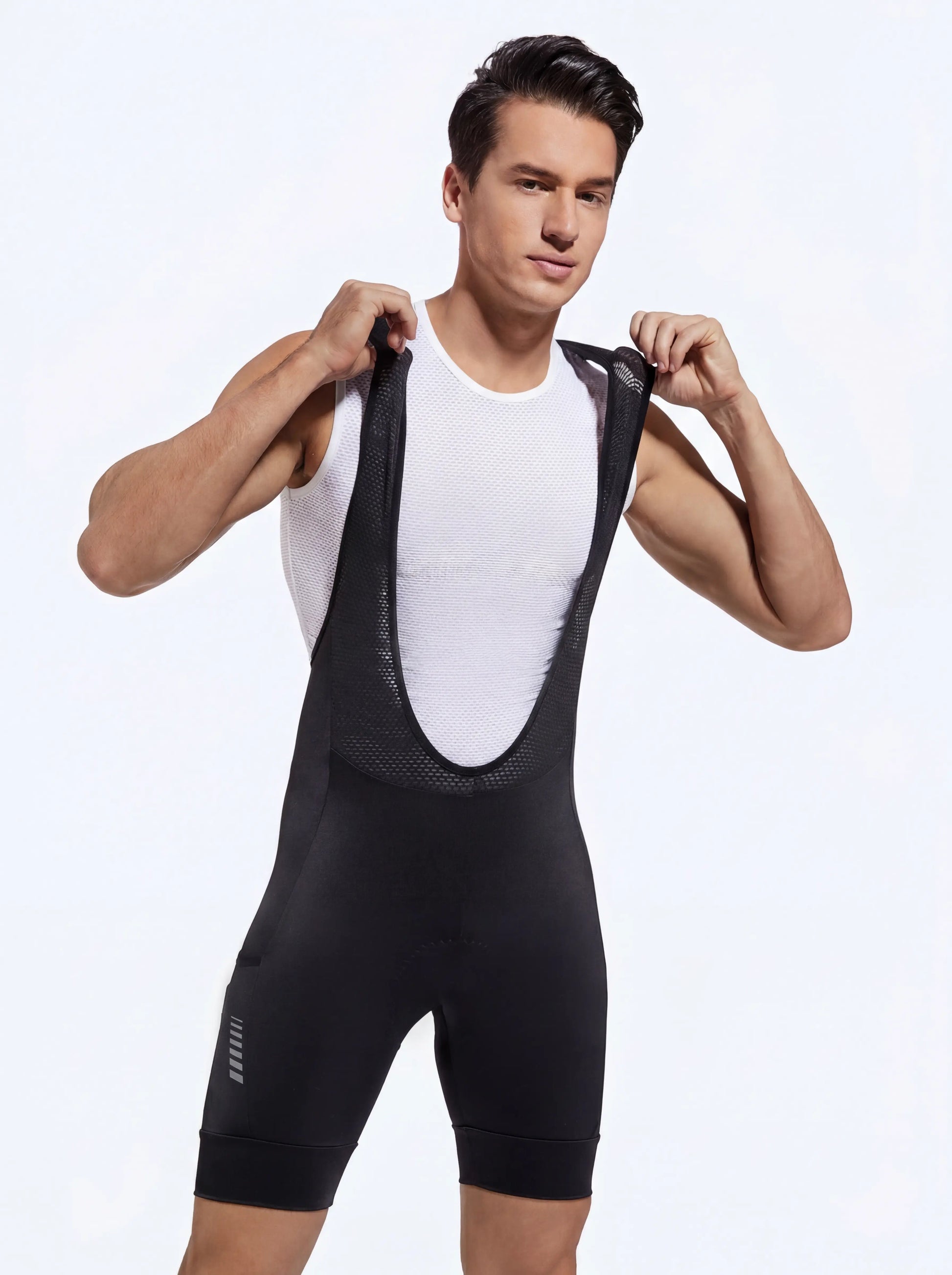 QUALICOS Men's MTB Performance Bib Shorts black front view on model with stretch mesh bib straps and leg grippers