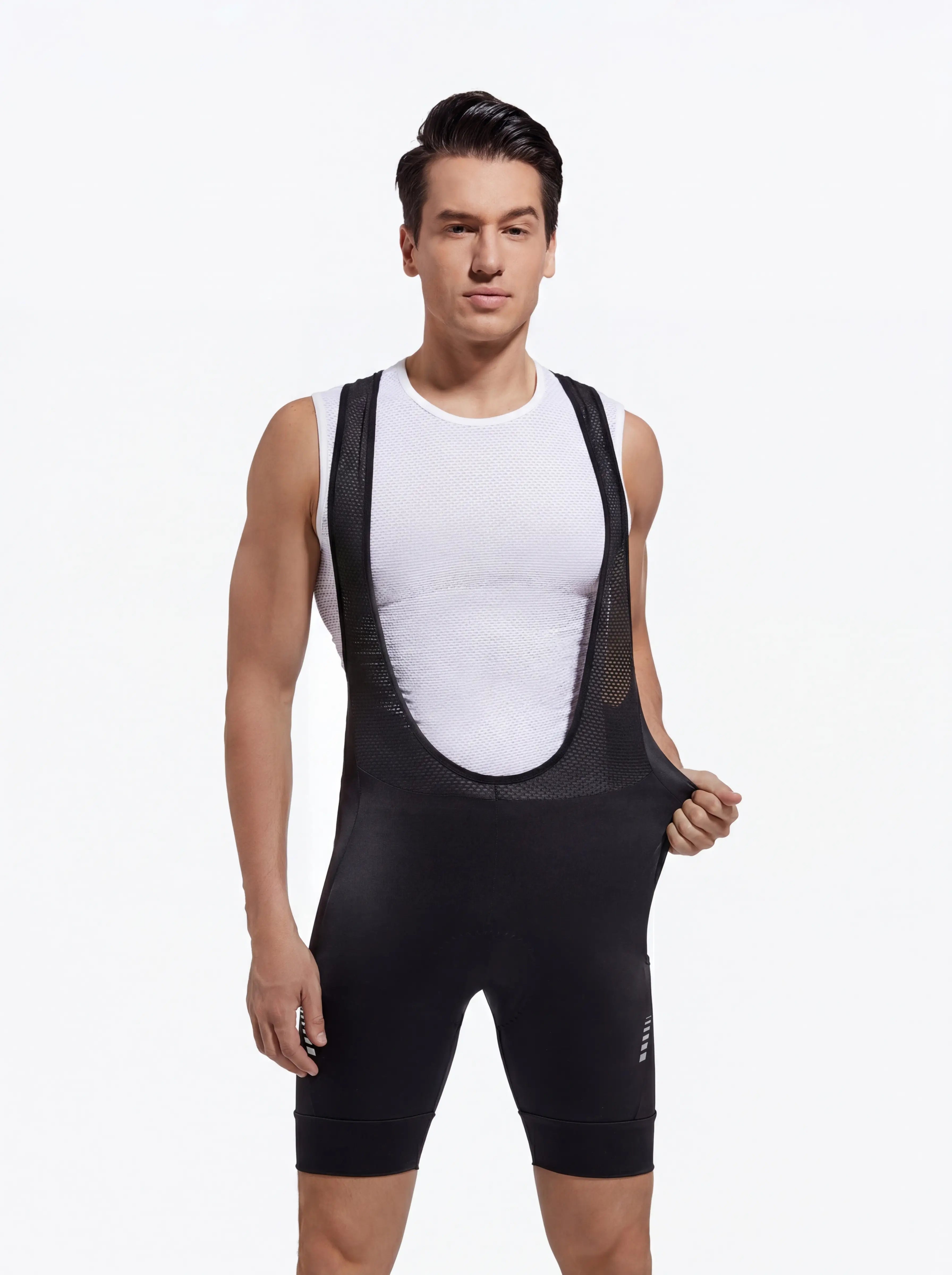 QUALICOS Men's MTB Performance Bib Shorts black front view on model with breathable mesh bib straps and stretch fit