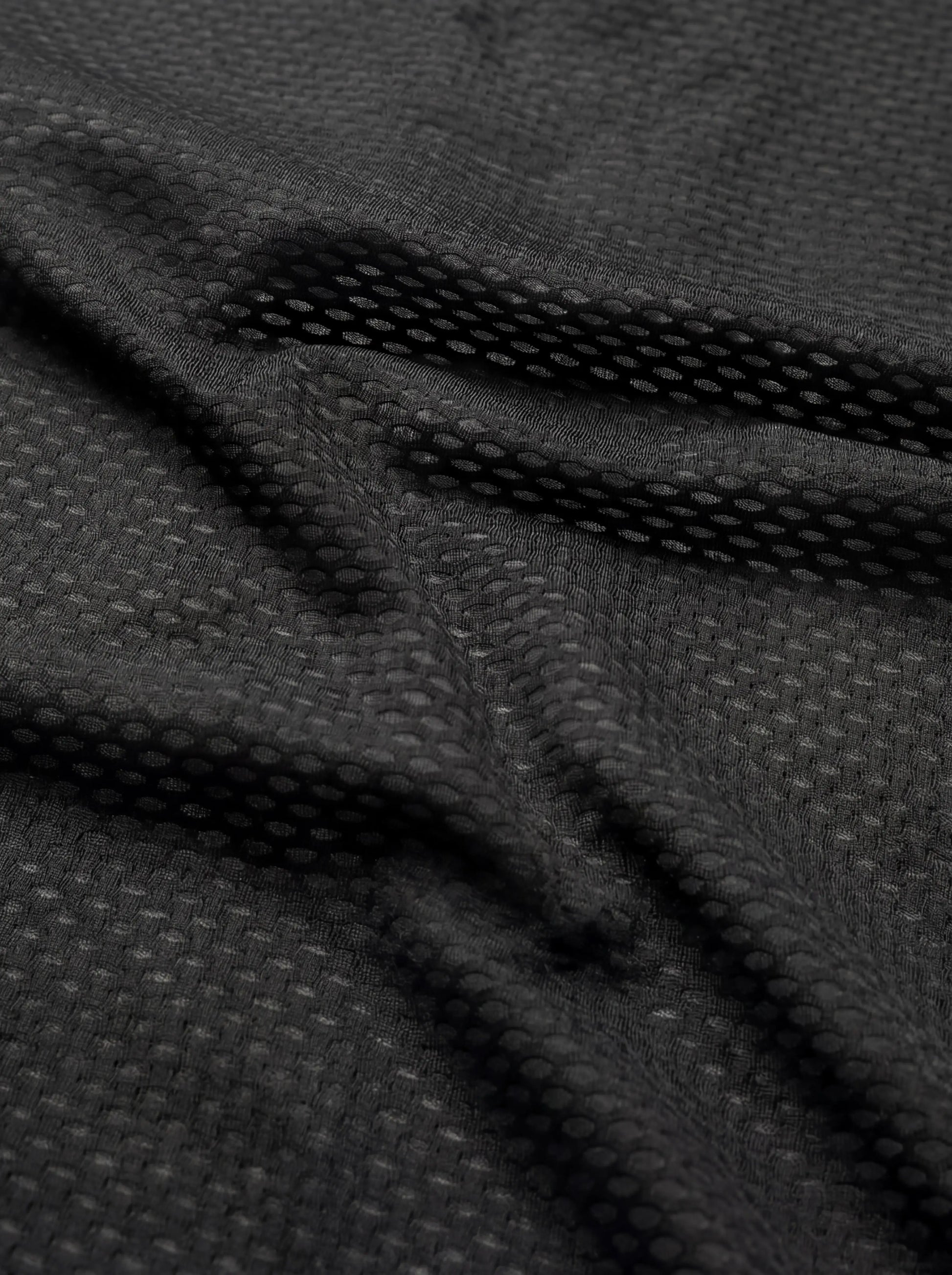 QUALICOS Men's Windproof Cycling Vest close-up breathable black mesh fabric for airflow and comfort
