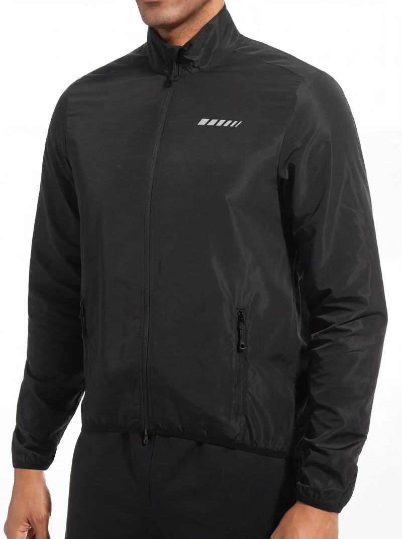QUALICOS Men's Windproof Long Sleeve Jacket on model, black full-zip cycling jacket with reflective chest detail