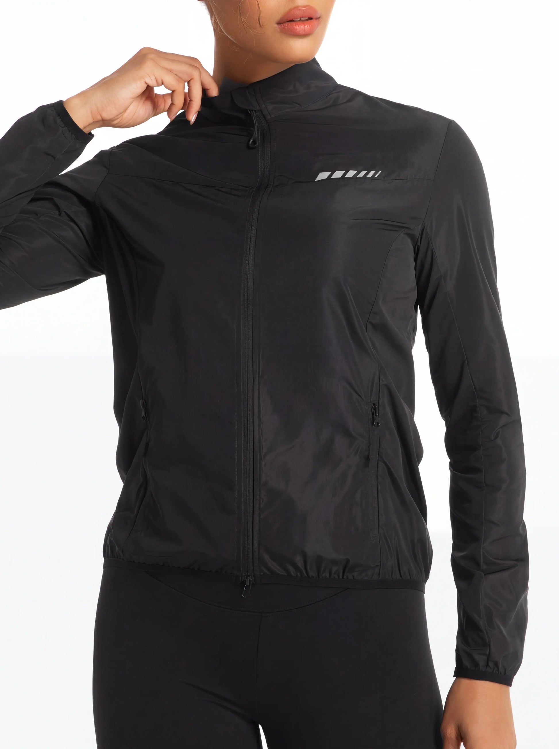 QUALICOS Women's Windproof Cycling Long Sleeve Jacket black full-zip jacket on model with reflective chest detail